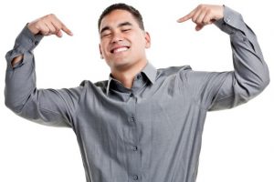 Guy is pointing at himself with pride